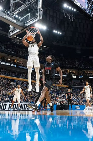 Nimari Burnett (4), Morez Johnson Jr. (21), and Yaxel Lendeborg (23)
