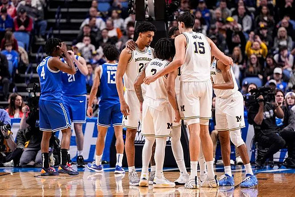 Yaxel Lendeborg (23), Elliot Cadeau (3), Aday Mara (15), and Nimari Burnett (4)