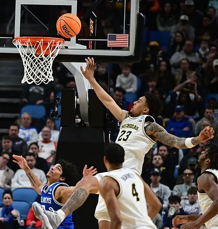 Nimari Burnett (4), Yaxel Lendeborg (23), and Morez Johnson Jr. (21)