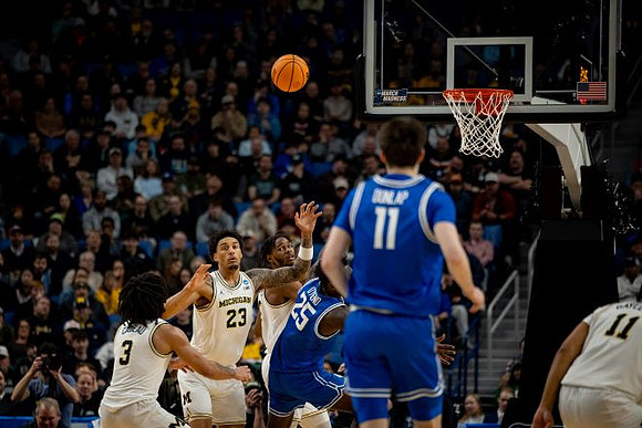 Elliot Cadeau (3), Yaxel Lendeborg (23), Morez Johnson Jr. (21), and Roddy Gayle Jr. (11)