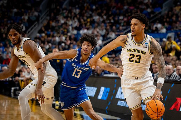 Morez Johnson Jr. (21) and Yaxel Lendeborg (23)
