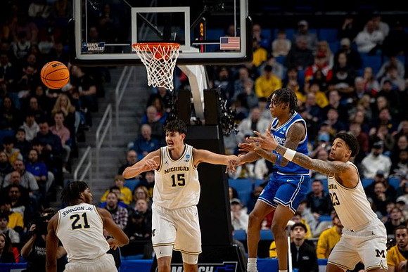 Morez Johnson Jr. (21), Aday Mara (15), and Yaxel Lendeborg (23)