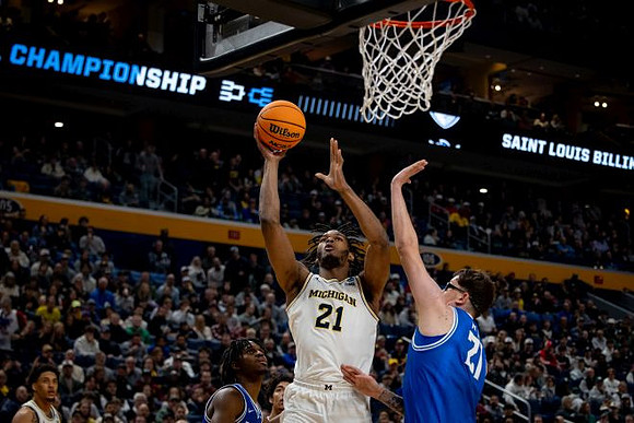 Yaxel Lendeborg (23) and Morez Johnson Jr. (21)