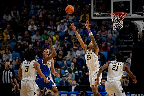 Elliot Cadeau (3), Yaxel Lendeborg (23), and Morez Johnson Jr. (21)