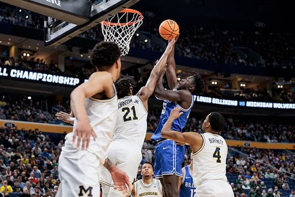 Yaxel Lendeborg (23), Morez Johnson Jr. (21), Trey McKenney (1), and Nimari Burnett (4)