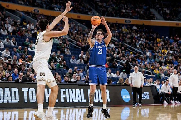 Aday Mara (15) and Saint Louis Head Coach Josh Schertz