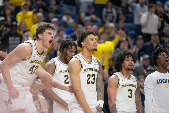 Will Tschetter (42), Morez Johnson Jr. (21), Yaxel Lendeborg (23), Elliot Cadeau (3), and L.J. Cason (2)