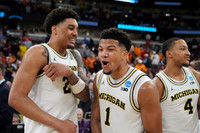 Yaxel Lendeborg (23), Trey McKenney (1), and Nimari Burnett (4)