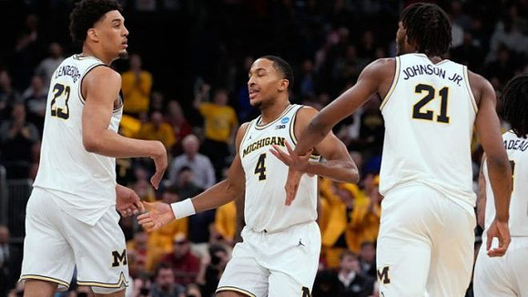 Yaxel Lendeborg (23), Nimari Burnett (4), and Morez Johnson Jr. (21)