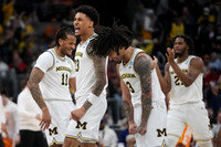 Roddy Gayle Jr. (11), Yaxel Lendeborg (23), Elliot Cadeau (3), and Morez Johnson Jr. (21)