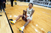 Yaxel Lendeborg (23) and Midwest Regional Championship Trophy