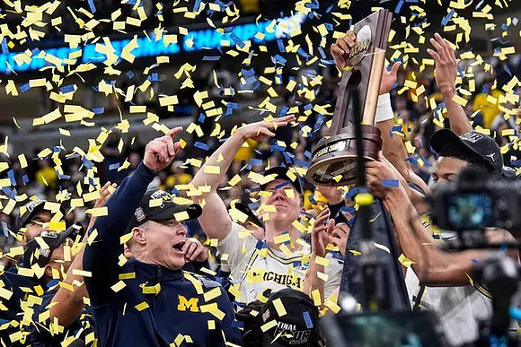 Dusty May, Michigan Team, and Midwest Regional Championship Trophy