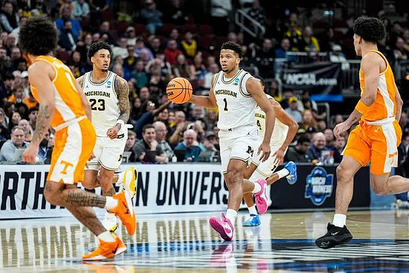 Yaxel Lendeborg (23), Trey McKenney (1), and Nimari Burnett (4)