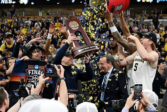Dusty May, Michigan Team, and Midwest Regional Championship Trophy