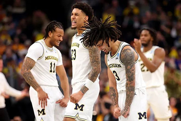 Roddy Gayle Jr. (11), Yaxel Lendeborg (23), Elliot Cadeau (3), and Morez Johnson Jr. (21)