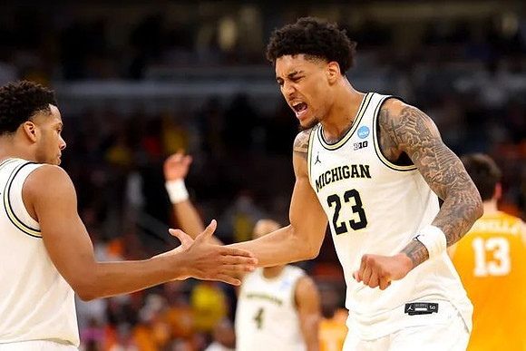 Trey McKenney (1), Yaxel Lendeborg (23), and Nimari Burnett (4)