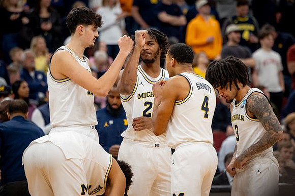Yaxel Lendeborg (23), Aday Mara (15), Morez Johnson Jr. (21), Nimari Burnett (4), and Elliot Cadeau (3)