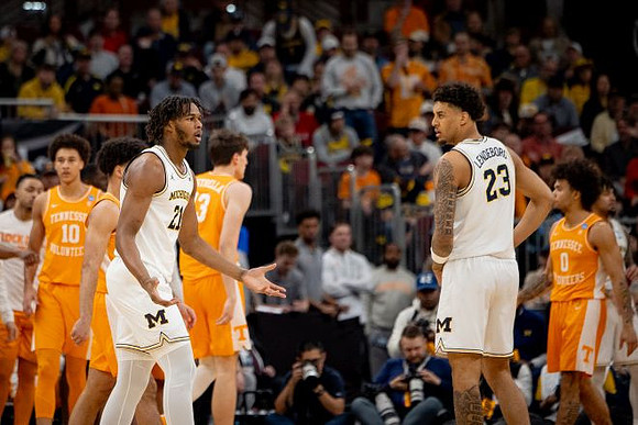 Morez Johnson Jr. (21) and Yaxel Lendeborg (23)