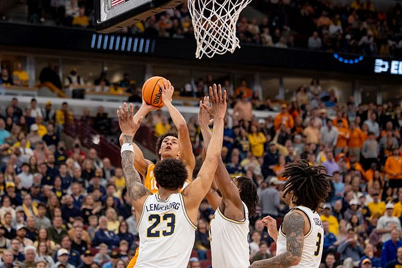 Yaxel Lendeborg (23), Morez Johnson Jr. (21), and Elliot Cadeau (3)