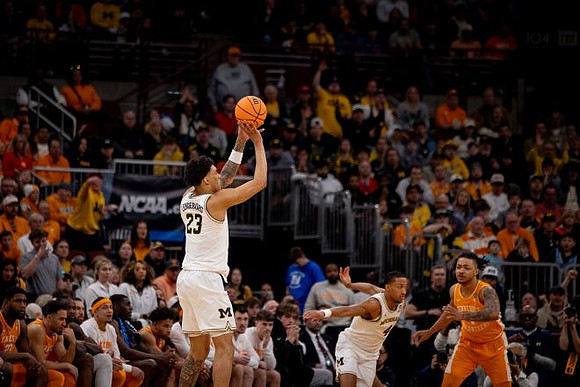 Yaxel Lendeborg (23) and Nimari Burnett (4)