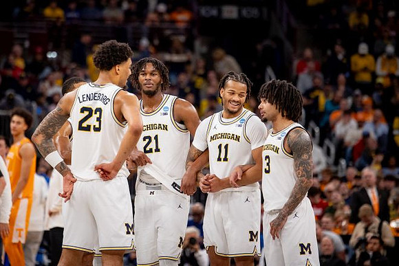 Yaxel Lendeborg (23), Morez Johnson Jr. (21), Roddy Gayle Jr. (11), and Elliot Cadeau (3)
