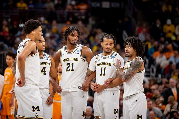 Yaxel Lendeborg (23), Nimari Burnett (4), Morez Johnson Jr. (21), Roddy Gayle Jr. (11), and Elliot Cadeau (3)