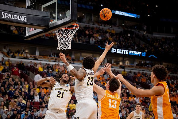 Morez Johnson Jr. (21), Yaxel Lendeborg (23), and Will Tschetter (42)