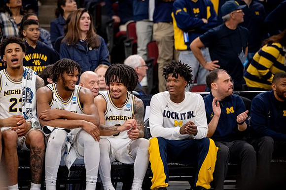 Yaxel Lendeborg (23), Morez Johnson Jr. (21), Elliot Cadeau (3), and L.J. Cason (2)