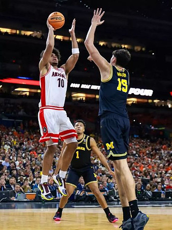 Trey McKenney (1) and Aday Mara (15)