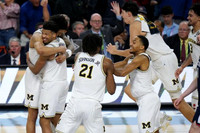 Yaxel Lendeborg (23), Trey McKenney (1), Morez Johnson Jr. (21), Nimari Burnett (4), and Aday Mara (15)