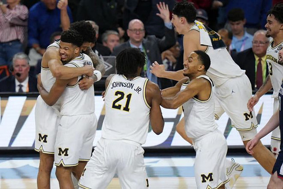 Yaxel Lendeborg (23), Trey McKenney (1), Morez Johnson Jr. (21), Nimari Burnett (4), and Aday Mara (15)
