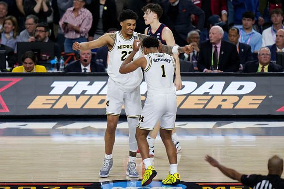 Yaxel Lendeborg (23) and Trey McKenney (1)