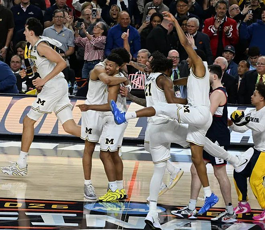 Aday Mara (15), Yaxel Lendeborg (23), Trey McKenney (1), Morez Johnson Jr. (21), Nimari Burnett (4), and Howard Eisley Jr. (7)