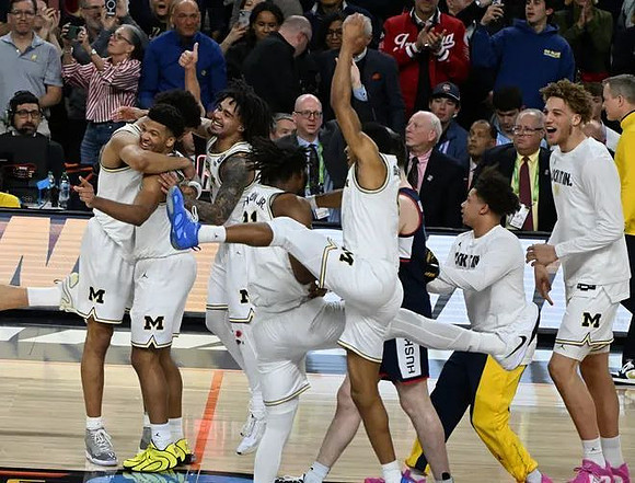 Yaxel Lendeborg (23), Trey McKenney (1), Elliot Cadeau (3), Morez Johnson Jr. (21), Nimari Burnett (4), Howard Eisley Jr. (7), and Malick Kordel (32)