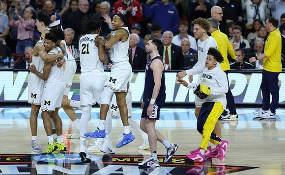 Yaxel Lendeborg (23), Trey McKenney (1), Morez Johnson Jr. (21), Nimari Burnett (4), Malick Kordel (32), and Howard Eisley Jr. (7)