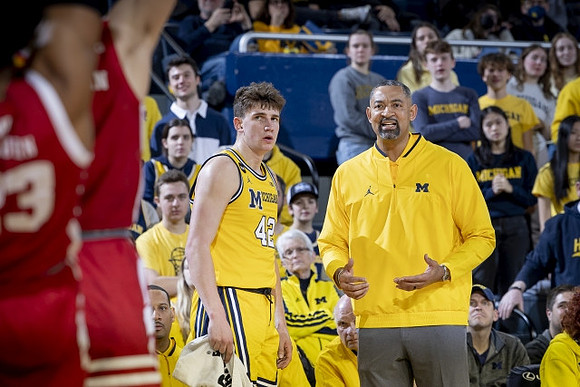 Will Tschetter (42) and Juwan Howard