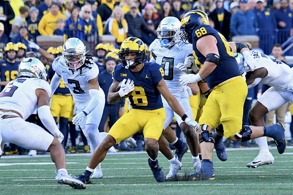 Tyler Morris (8) and Josh Priebe (68)