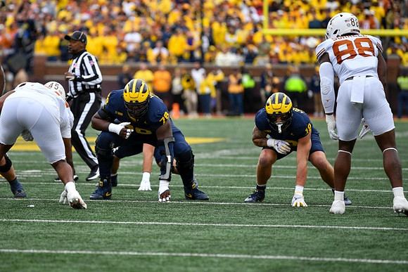 Myles Hinton (78) and Colston Loveland (18)