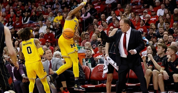 Dug McDaniel (0), Kobe Bufkin (2), and Wisconsin Head Coach Greg Gard