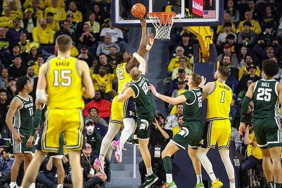 Joey Baker (15), Tarris Reed Jr. (32), and Hunter Dickinson (1)
