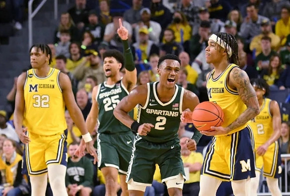 Tarris Reed Jr. (32), Dug McDaniel (0), and Kobe Bufkin (2)