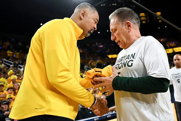 Juwan Howard and Michigan State Head Coach Tom Izzo
