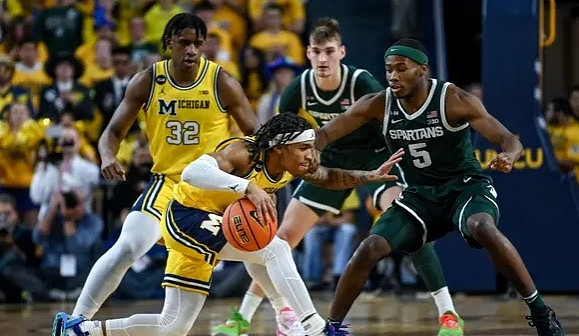 Tarris Reed Jr. (32) and Dug McDaniel (0)