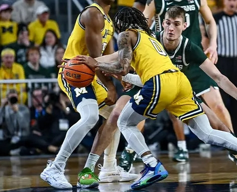 Jace Howard (25) and Dug McDaniel (0)