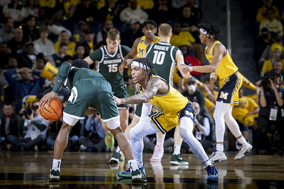 Dug McDaniel (0), Tarris Reed Jr. (32), and Kobe Bufkin (2)