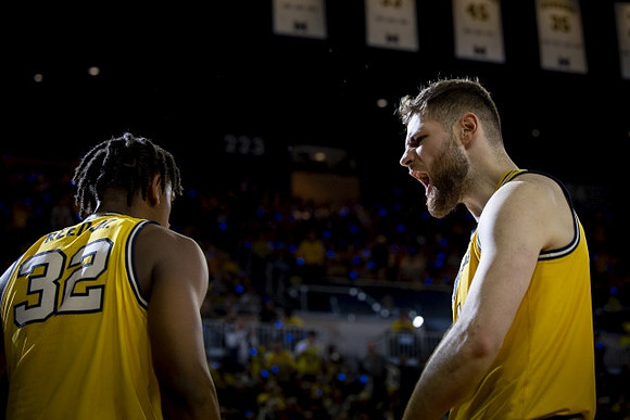 Tarris Reed Jr. (32) and Hunter Dickinson (1)