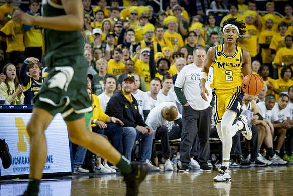 Kobe Bufkin (2) and Michigan State Head Coach Tom Izzo