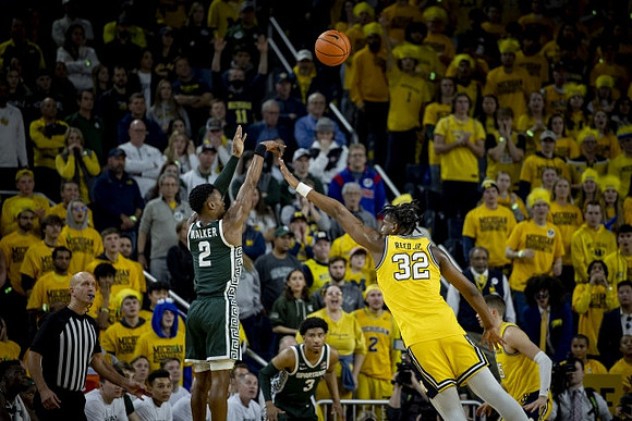Tarris Reed Jr. (32) and Joey Baker (15)