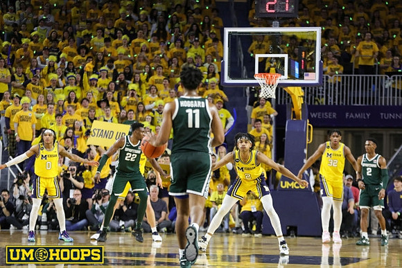Dug McDaniel (0), Kobe Bufkin (2), and Tarris Reed Jr. (32)