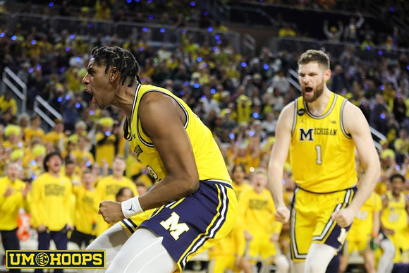 Tarris Reed Jr. (32) and Hunter Dickinson (1)